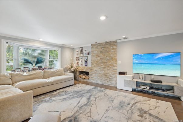 Fireplace, Interior, Living room, Recessed Lighting, Stone Walls, Wood Texture Flooring