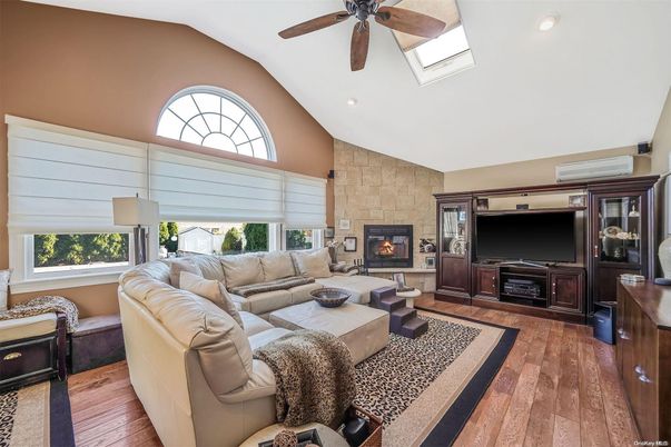 Fireplace, Interior, Living room, Recessed Lighting, Stone Walls, Wood Texture Flooring