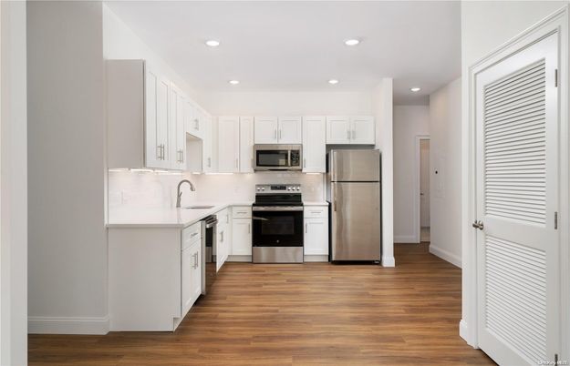 Interior, Kitchen, Recessed Lighting, Stainless Steel Appliances, Wood Texture Flooring