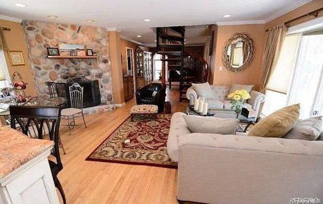 Fireplace, Interior, Living room, Recessed Lighting, Stone Walls, Wood Texture Flooring