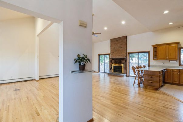 Fireplace, Interior, Kitchen, Recessed Lighting, Stone Walls, Wood Texture Flooring