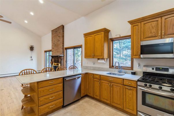 Dining room, Interior, Kitchen, Recessed Lighting, Stainless Steel Appliances, Wood Texture Flooring