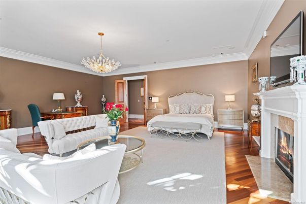 Bedroom, Chandelier, Fireplace, Interior, Living room, Recessed Lighting, Wood Texture Flooring