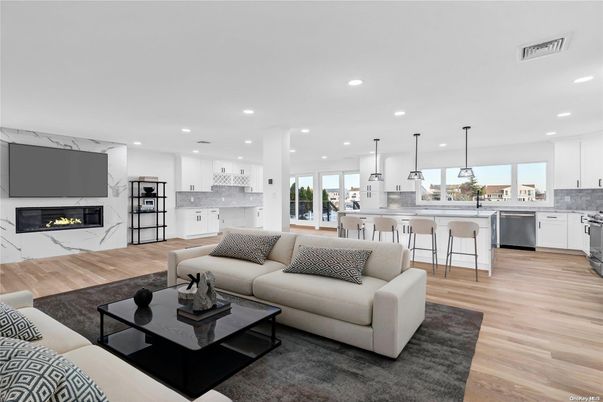 Fireplace, Interior, Kitchen, Living room, Marble Walls, Pendant Lights, Recessed Lighting, Stainless Steel Appliances, Wood Texture Flooring