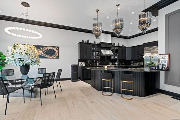 Chandelier, Dining room, Interior, Kitchen, Pendant Lights, Recessed Lighting, Stainless Steel Appliances, Wood Texture Flooring
