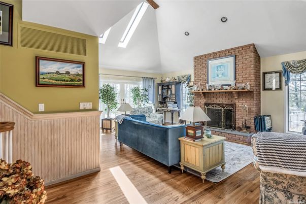 Fireplace, Interior, Living room, Recessed Lighting, Stone Walls, Wood Texture Flooring