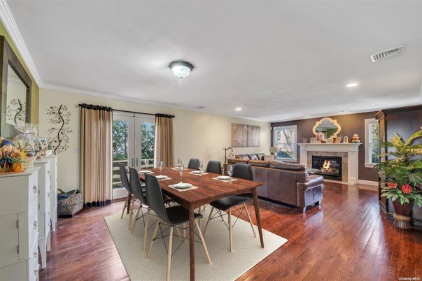 Dining room, Fireplace, Interior, Living room, Recessed Lighting, Wood Texture Flooring