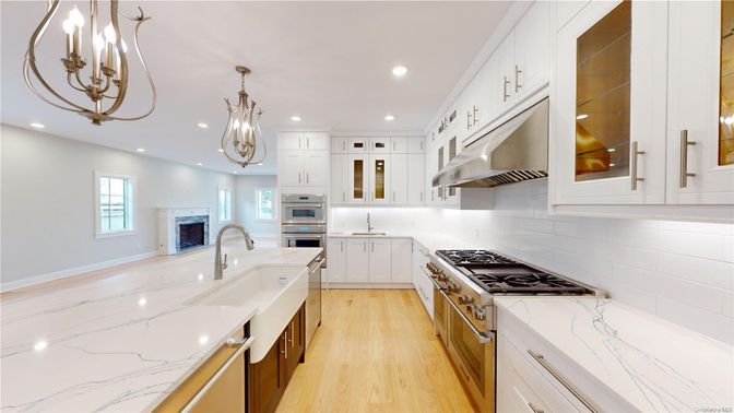 Chandelier, Fireplace, Interior, Kitchen, Recessed Lighting, Stainless Steel Appliances, Wood Texture Flooring
