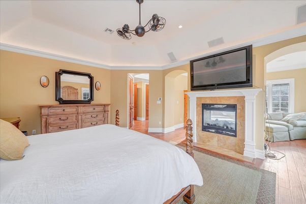 Bedroom, Fireplace, Interior, Pendant Lights, Recessed Lighting, Wood Texture Flooring