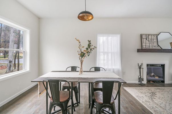Dining room, Fireplace, Interior, Pendant Lights, Wood Texture Flooring