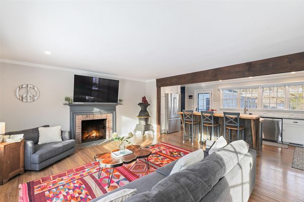 Fireplace, Interior, Kitchen, Living room, Recessed Lighting, Stainless Steel Appliances, Wood Texture Flooring