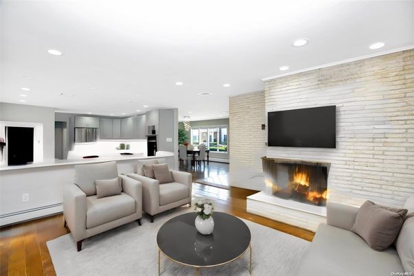 Dining room, Fireplace, Interior, Kitchen, Living room, Recessed Lighting, Stainless Steel Appliances, Stone Walls, Wood Texture Flooring