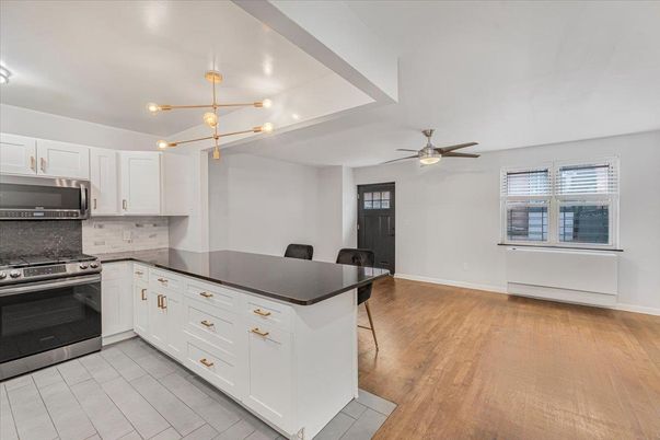 Dining room, Interior, Kitchen, Pendant Lights, Stainless Steel Appliances, Wood Texture Flooring