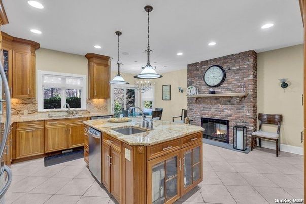 Fireplace, Interior, Kitchen, Pendant Lights, Recessed Lighting, Stainless Steel Appliances, Stone Walls