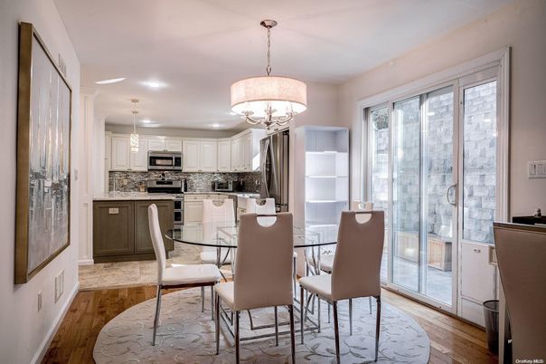 Chandelier, Dining room, Interior, Kitchen, Pendant Lights, Recessed Lighting, Stainless Steel Appliances, Wood Texture Flooring