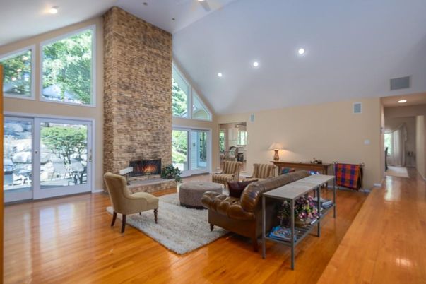 Fireplace, Interior, Living room, Recessed Lighting, Stone Walls, Wood Texture Flooring