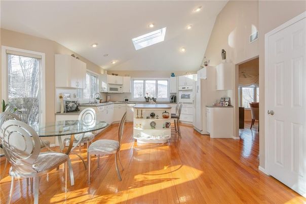 Dining room, Interior, Kitchen, Recessed Lighting, Stainless Steel Appliances, Wood Texture Flooring