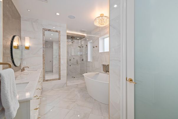 Bathroom, Chandelier, Dual Sink Vanities, Free Standing Baths, Glass Shower, Interior, Marble, Marble Walls, Recessed Lighting