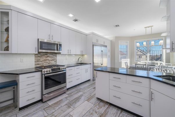 Dining room, Interior, Kitchen, Pendant Lights, Recessed Lighting, Stainless Steel Appliances, Wood Texture Flooring