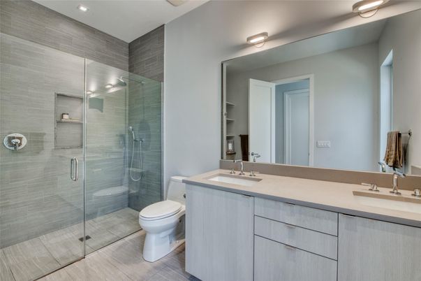 Bathroom, Dual Sink Vanities, Glass Shower, Interior, Recessed Lighting, Wood Texture Flooring