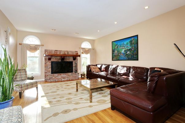 Fireplace, Interior, Living room, Recessed Lighting, Stone Walls, Wood Texture Flooring