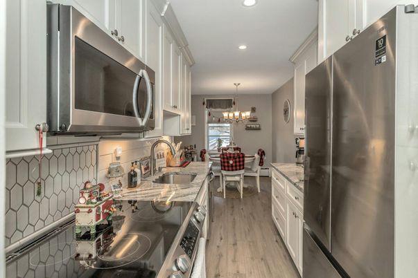 Chandelier, Dining room, Interior, Kitchen, Recessed Lighting, Stainless Steel Appliances, Wood Texture Flooring