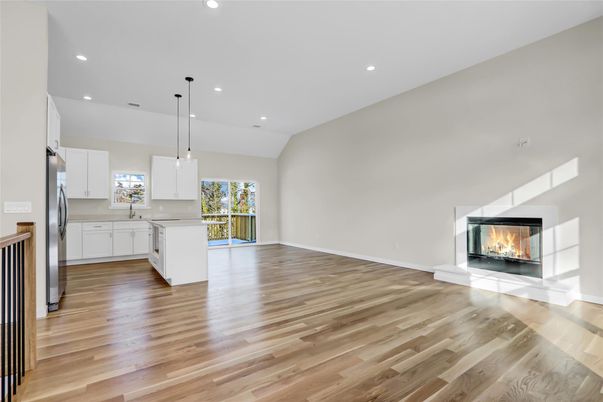 Empty room, Fireplace, Interior, Kitchen, Pendant Lights, Recessed Lighting, Wood Texture Flooring