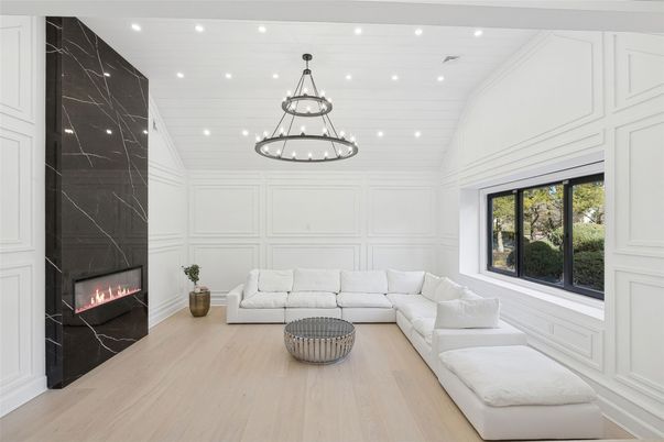 Fireplace, Interior, Living room, Marble Walls, Pendant Lights, Recessed Lighting, Wood Texture Flooring