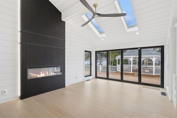 Fireplace, Glass Ceilings, Interior, Recessed Lighting, Sun Room, Wood Texture Flooring