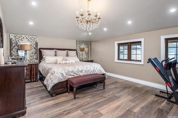 Bedroom, Chandelier, Fitness Equipment, Interior, Recessed Lighting, Wood Texture Flooring