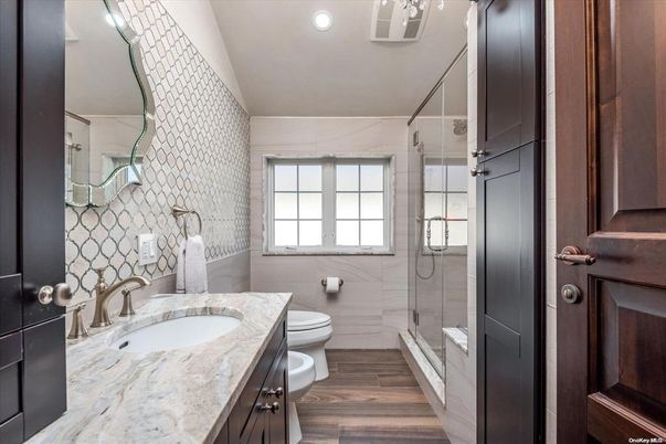 Bathroom, Dual Sink Vanities, Glass Shower, Interior, Recessed Lighting, Wood Texture Flooring