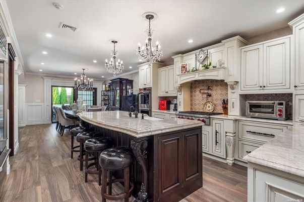 Chandelier, Dining room, Interior, Kitchen, Recessed Lighting, Stainless Steel Appliances, Wood Texture Flooring