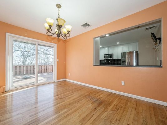 Chandelier, Empty room, Interior, Kitchen, Recessed Lighting, Stainless Steel Appliances, Wood Texture Flooring