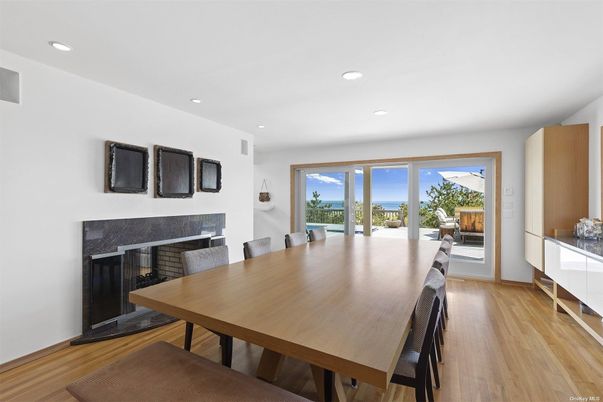 Dining room, Fireplace, Interior, Recessed Lighting, Water, Wood Texture Flooring