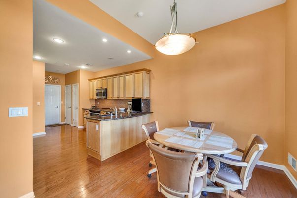 Dining room, Interior, Kitchen, Pendant Lights, Recessed Lighting, Stainless Steel Appliances, Wood Texture Flooring