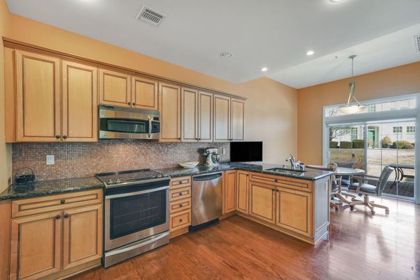 Dining room, Interior, Kitchen, Pendant Lights, Recessed Lighting, Stainless Steel Appliances, Wood Texture Flooring