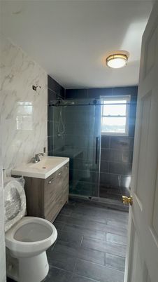 Bathroom, Glass Shower, Interior, Marble Walls, Wood Texture Flooring