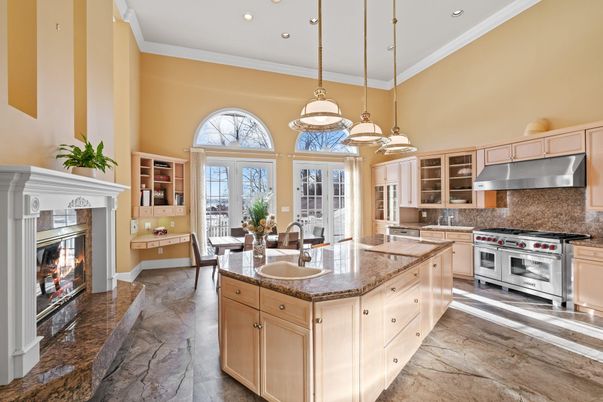 Dining room, Fireplace, Interior, Kitchen, Pendant Lights, Recessed Lighting, Stainless Steel Appliances, Wood Texture Flooring
