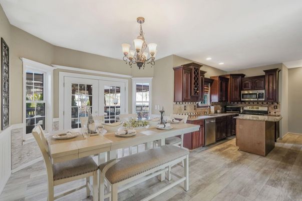 Chandelier, Dining room, Interior, Kitchen, Recessed Lighting, Stainless Steel Appliances, Wood Texture Flooring