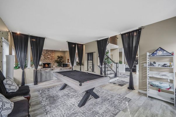 Billiard Table, Fireplace, Game Room, Interior, Recessed Lighting, Stone Walls, Wood Texture Flooring
