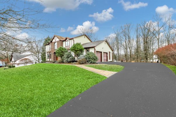 Attached, Backyard, Exterior, Facade, Brick Facade, Tudor Revival