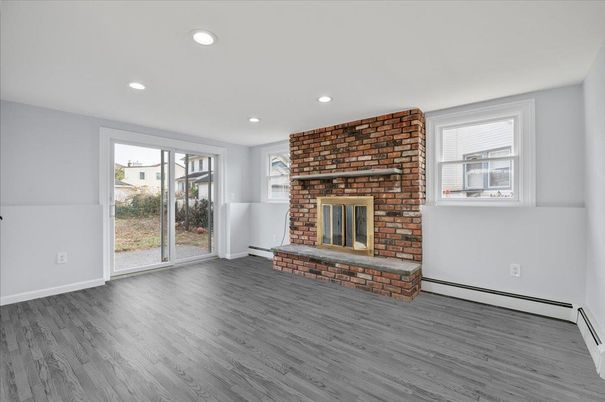 Empty room, Fireplace, Interior, Recessed Lighting, Stone Walls, Wood Texture Flooring