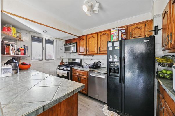 Interior, Kitchen, Tile Countertops, Wood Texture Flooring
