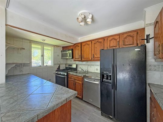 Interior, Kitchen, Tile Countertops, Wood Texture Flooring