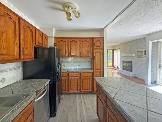 Fireplace, Interior, Kitchen, Tile Countertops, Wood Texture Flooring