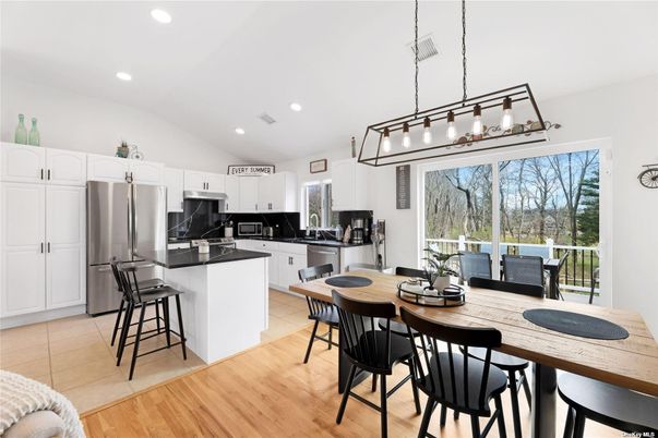 Dining room, Interior, Kitchen, Pendant Lights, Recessed Lighting, Stainless Steel Appliances, Wood Texture Flooring
