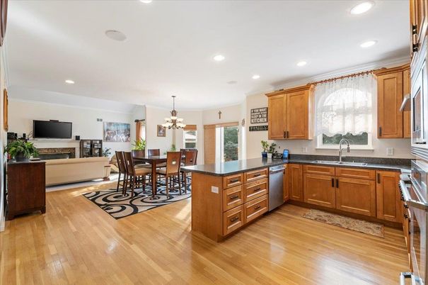 Chandelier, Dining room, Fireplace, Interior, Kitchen, Recessed Lighting, Wood Texture Flooring