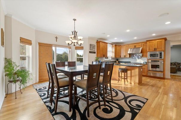 Chandelier, Dining room, Interior, Kitchen, Recessed Lighting, Stainless Steel Appliances, Wood Texture Flooring