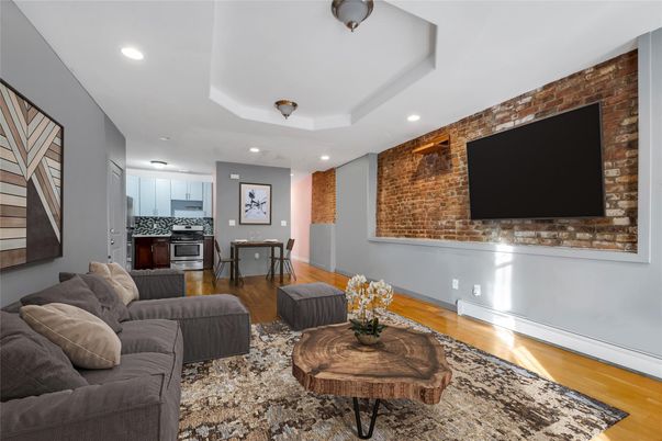 Interior, Kitchen, Living room, Recessed Lighting, Stainless Steel Appliances, Stone Walls, Wood Texture Flooring