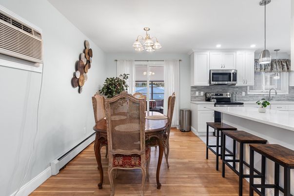 Chandelier, Dining room, Interior, Kitchen, Pendant Lights, Recessed Lighting, Stainless Steel Appliances, Wood Texture Flooring